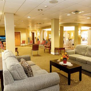 A cozy lobby with comfortable seating and warm lighting.