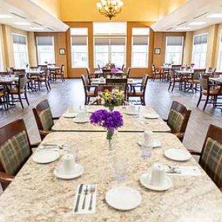 A bright and inviting dining room with tables set for meal service.