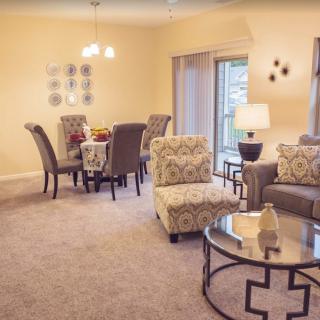 A cozy living room with an elegant dining area and stylish furniture.