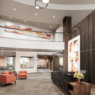 A modern lobby area with stylish furniture and contemporary artwork.