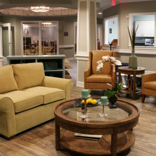 A cozy lounge area with comfortable seating and a coffee table.