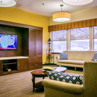 A cozy living room with modern decor and comfortable seating.