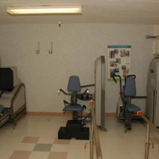 An indoor gym with various exercise machines.