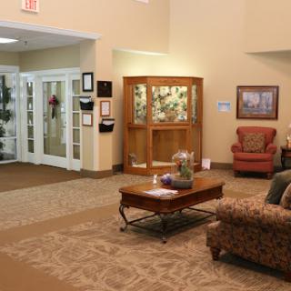 A cozy lobby area featuring comfortable seating and a decorative display.