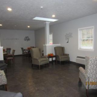 A spacious seating area with comfortable chairs and modern decor.