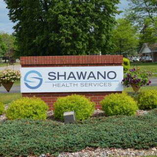 Signage for Shawano Health Services, indicating healthcare facilities in the area.