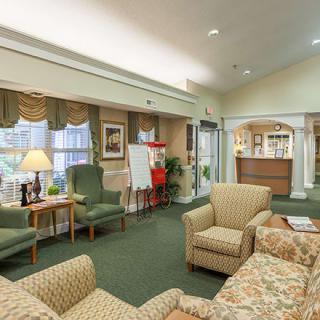 A cozy lobby with comfortable seating and a reception desk.