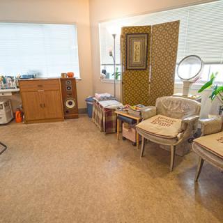 A cozy living room with vintage furniture and decor.