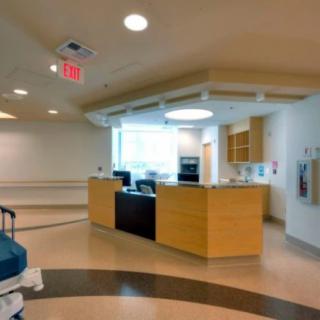 Hospital reception area with a modern design and clean interior.