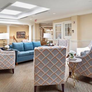 A cozy living room with comfortable seating and elegant decor.