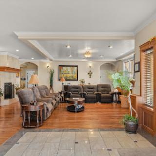 A spacious and inviting living room featuring comfortable seating and elegant decor.