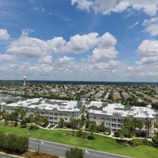 Aerial view of a suburban residential area under a partly cloudy sky.