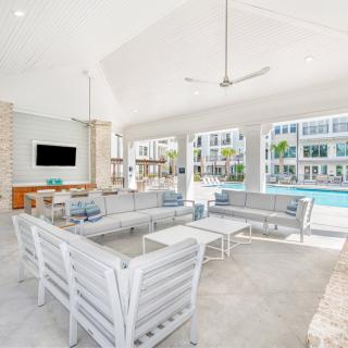 Modern poolside lounge area with comfortable seating and open views.