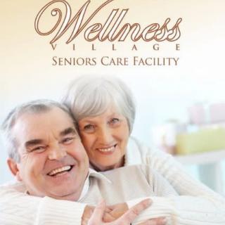 Elderly couple smiling at a wellness village seniors care facility.