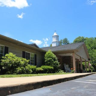 A picturesque view of a church building under a clear blue sky.