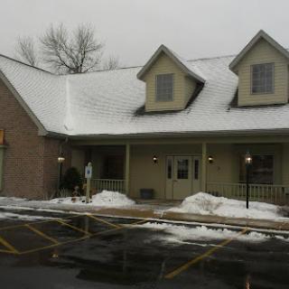 A cozy building covered in snow during winter.