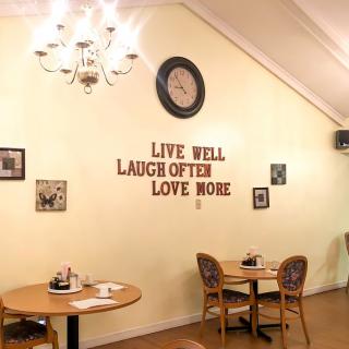 A cozy caf interior with inspirational wall art and vintage decor.