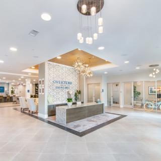 A modern and elegantly designed lobby with a welcoming reception area and stylish lighting.