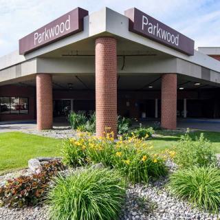 Entrance of a Parkwood building with landscaped garden.