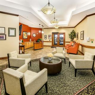 A cozy lobby area with comfortable seating and a reception desk.