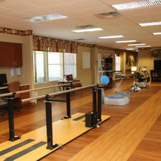 A rehabilitation and physical therapy center equipped with exercise equipment.