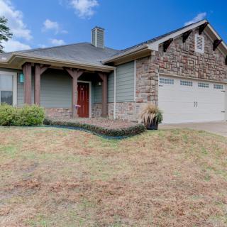 A suburban house with a stone facade and attached garage.