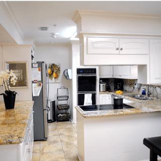 A modern kitchen with sleek appliances and elegant decor.