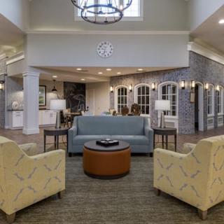 A cozy lounge area with modern furniture and elegant lighting.