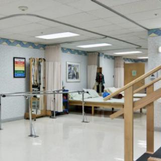 A hospital rehabilitation area equipped for physical therapy exercises.