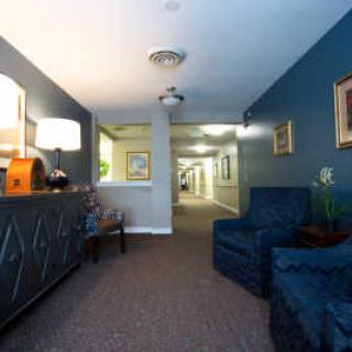 A cozy lobby area with seating and a reception desk.