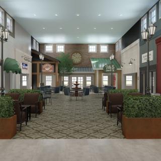 A spacious lobby with modern design, featuring comfortable seating and decorative plants.