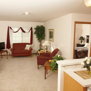 A cozy living room featuring comfortable furniture and a welcoming ambiance.