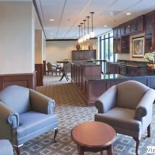 A cozy lounge area with comfortable seating and a well-lit interior.