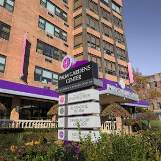 The entrance to a healthcare center featuring a prominently displayed sign.