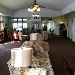 A spacious living room with elegant furniture and ample natural light.