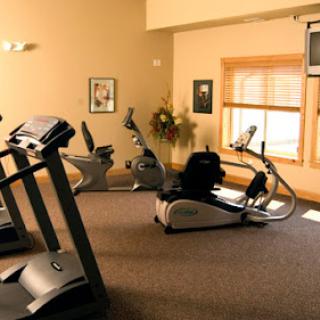 A well-equipped indoor gym featuring various exercise machines for a complete workout.
