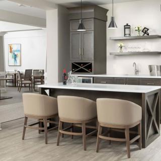 Modern kitchen with island seating and stylish decor.
