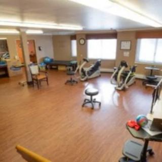 A spacious gym with exercise bikes and fitness equipment.