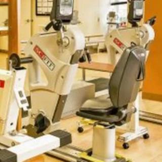 A gym setup featuring exercise equipment designed for cardiovascular workouts.