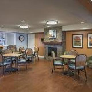 Cozy dining area with a fireplace and comfortable seating.
