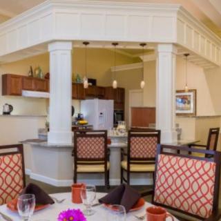 A stylish kitchen and dining area featuring elegant furniture and modern decor.