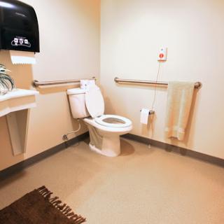 A clean and accessible restroom with essential amenities.