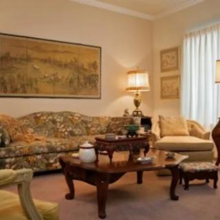 A cozy living room with vintage furniture and classic decor.