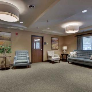 A modern lobby with comfortable seating and soft lighting.
