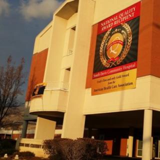 A building showcasing a large banner for the National Guard.