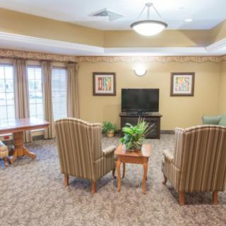 Cozy living room with comfortable seating and a TV.