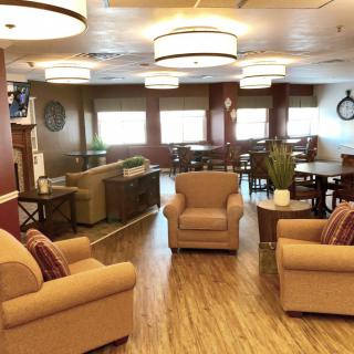 A cozy lounge area with comfortable seating and warm lighting.