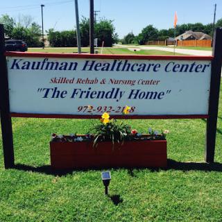 The Kaufman Healthcare Center sign, promoting their services as a friendly home for rehabilitation and senior care.