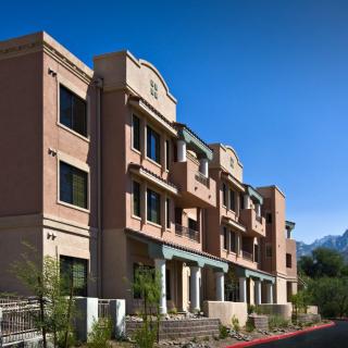 Modern apartment building under a clear blue sky.