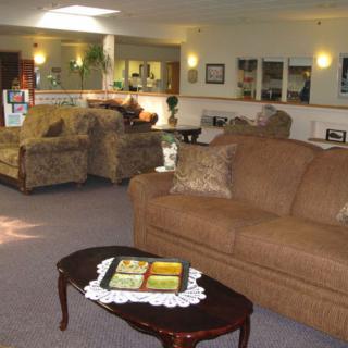 A cozy living room with comfortable sofas and a wooden coffee table.